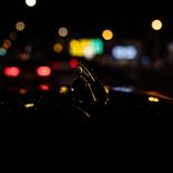 Rainy Night Drive Through the Neon Streets